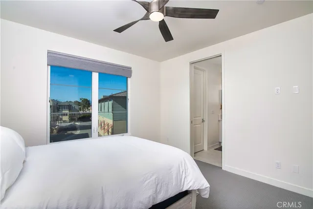 a living room with furniture and painting on the wall