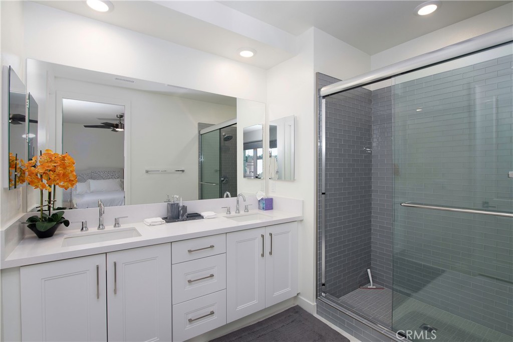 1523 Doheny Way Dana Point, CA 92629 - Photo 18 of 26 a bathroom with a double vanity sink mirror and shower
