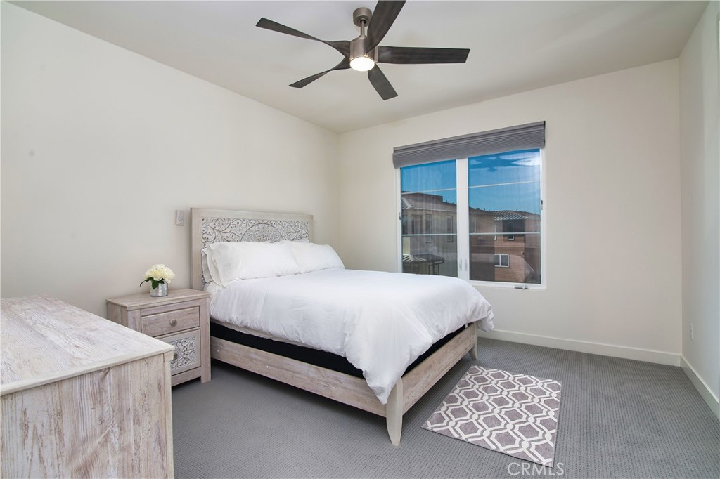 1523 Doheny Way Dana Point, CA 92629 - Photo 19 of 26 a bedroom with a bed and a large window