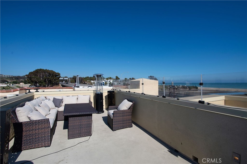 1523 Doheny Way Dana Point, CA 92629 - Photo 4 of 26 a view of a terrace with seating area