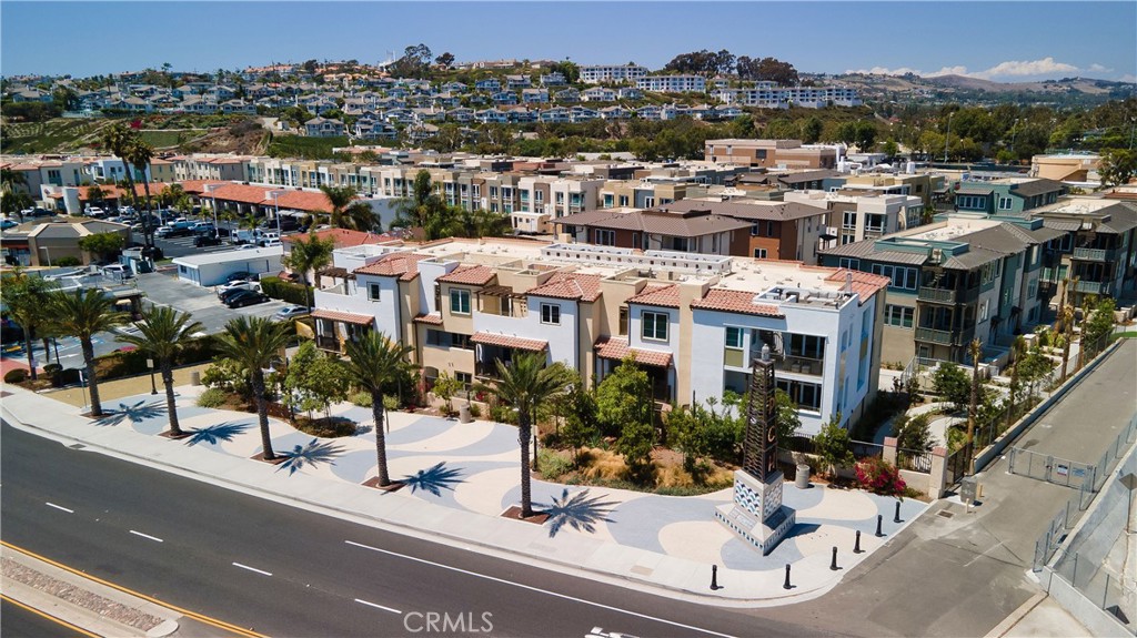 1523 Doheny Way Dana Point, CA 92629 - Photo 8 of 26 a view of a patio with a table and chairs under an umbrella