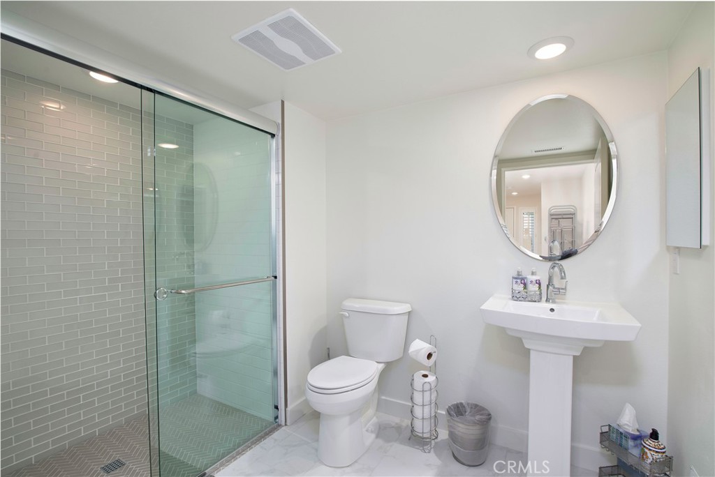 1523 Doheny Way Dana Point, CA 92629 - Photo 9 of 26 a bathroom with a toilet sink and mirror