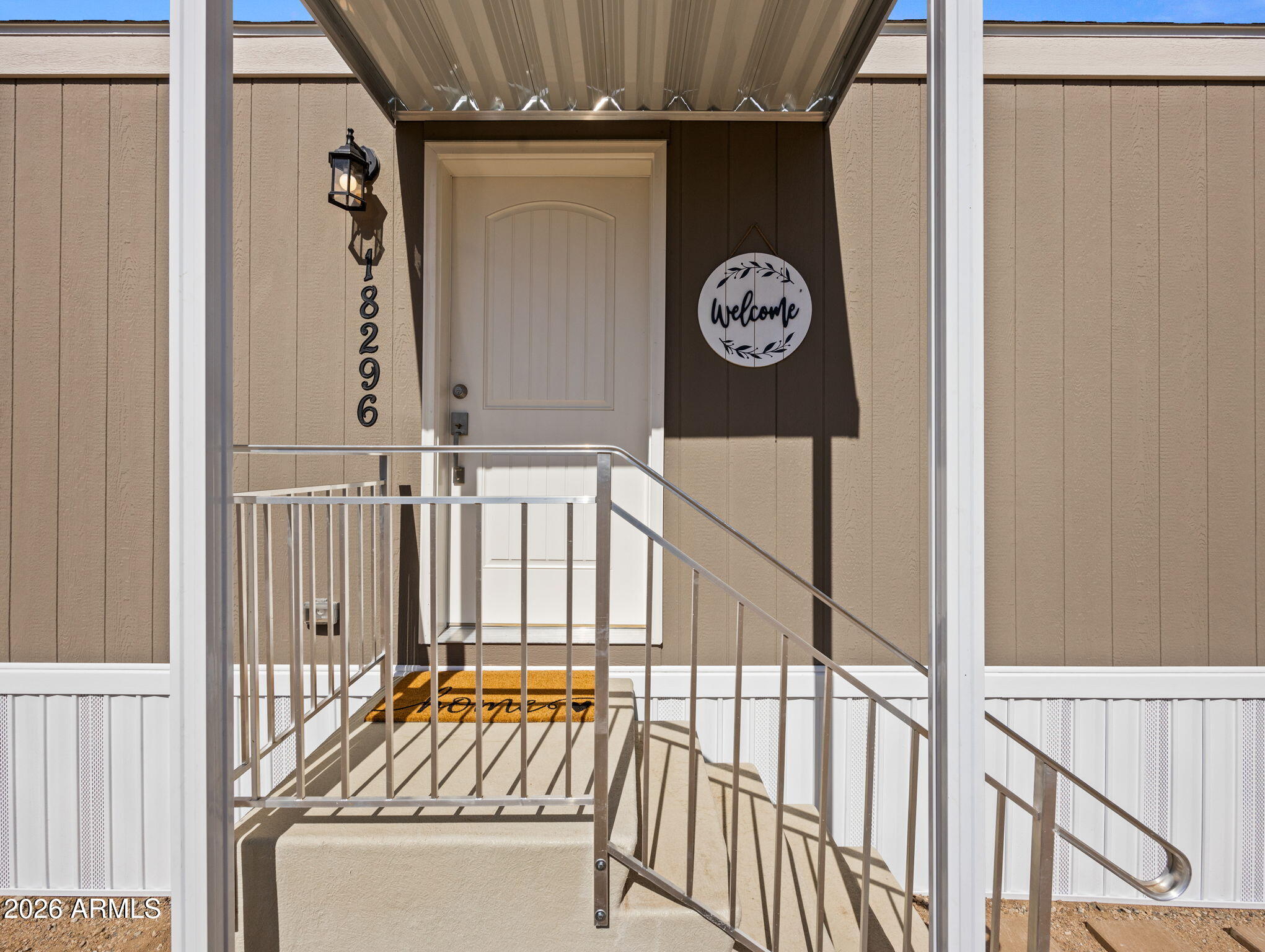 18296 Frontier Road Peeples Valley, AZ 86332 - Photo 7 of 44 a front view of a house with entryway and stairs