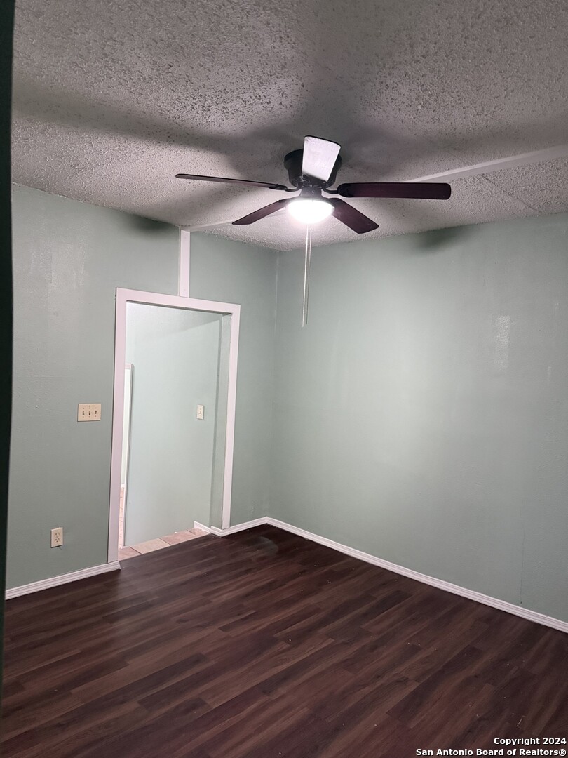 1902 Lennon Avenue, Unit 2 San Antonio, TX 78223 - Photo 3 of 16 a view of an empty room with wooden floor