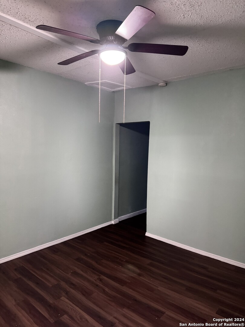 1902 Lennon Avenue, Unit 2 San Antonio, TX 78223 - Photo 4 of 16 a view of an empty room with wooden floor