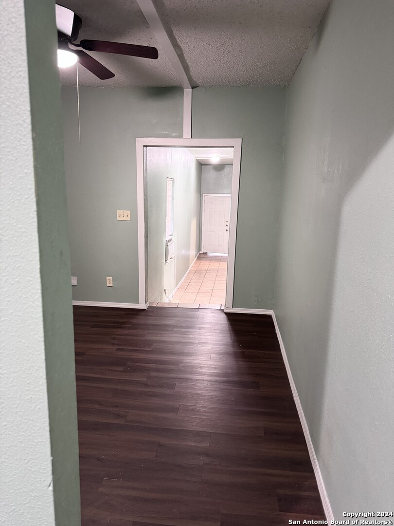 1902 Lennon Avenue, Unit 2 San Antonio, TX 78223 - Photo 5 of 16 a view of an empty room with wooden floor