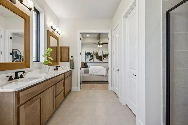 a en suite bathroom with a double sink double vanity