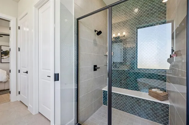 a bathroom with a shower and a sink