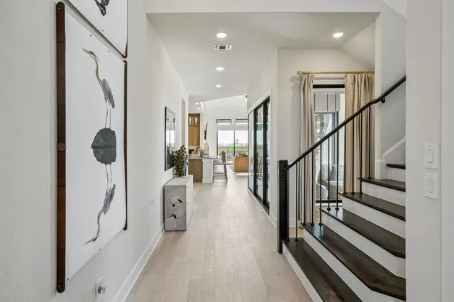 a view of entryway with wooden floor and windows