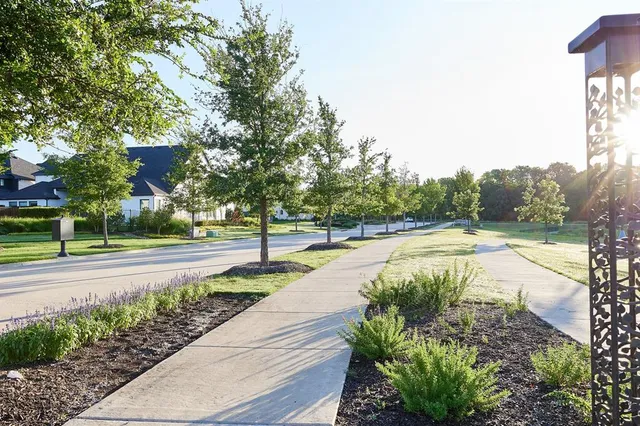 a swimming pool with outdoor seating and garden