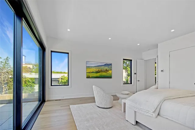 a bedroom with bed and window