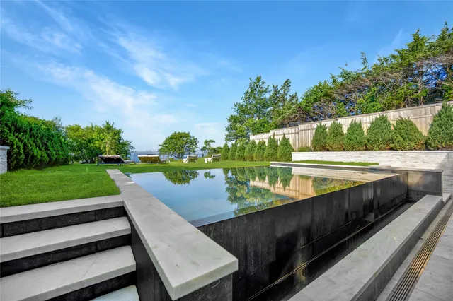 a view of a wooden deck with lake view