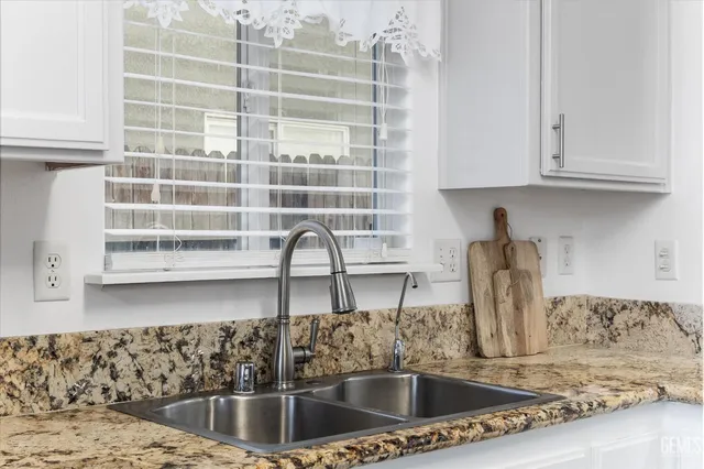 a kitchen with a sink and a window
