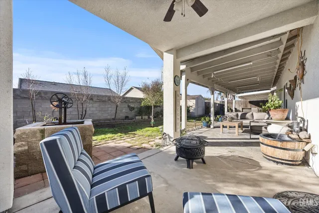 a outdoor living space with furniture and a fireplace