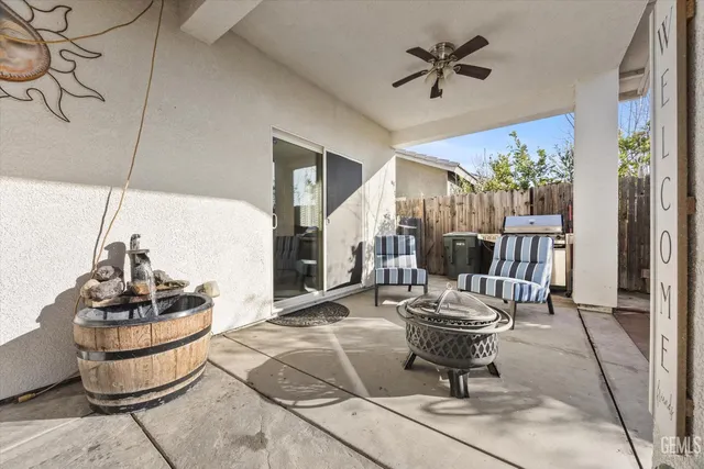 a living room with couch and a potted plant