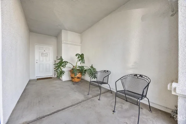 a view of a chair and table in the room