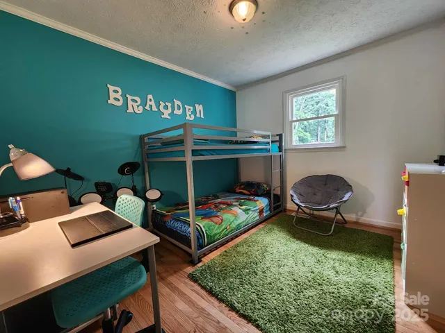 a bedroom with a bed and a bookshelf