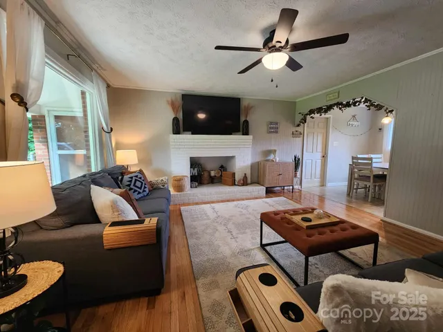 a living room with furniture and a flat screen tv