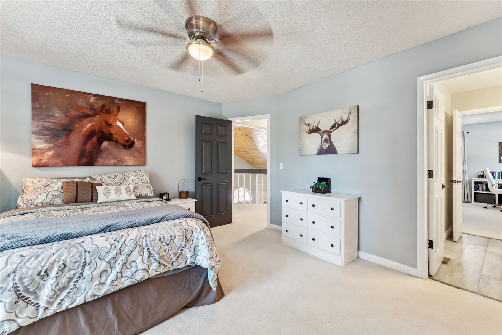 109 Old Corral Road Bailey, CO 80421 - Photo 26 of 50 Bedroom with carpet floors, ceiling fan, baseboards, and a textured ceiling