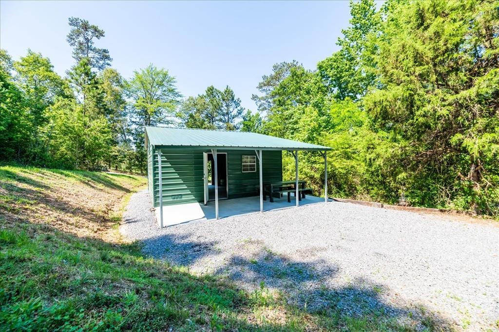 711 Redman Lane Decatur, TN 37322 - Photo 1 of 33 a view of a house with a yard and garden