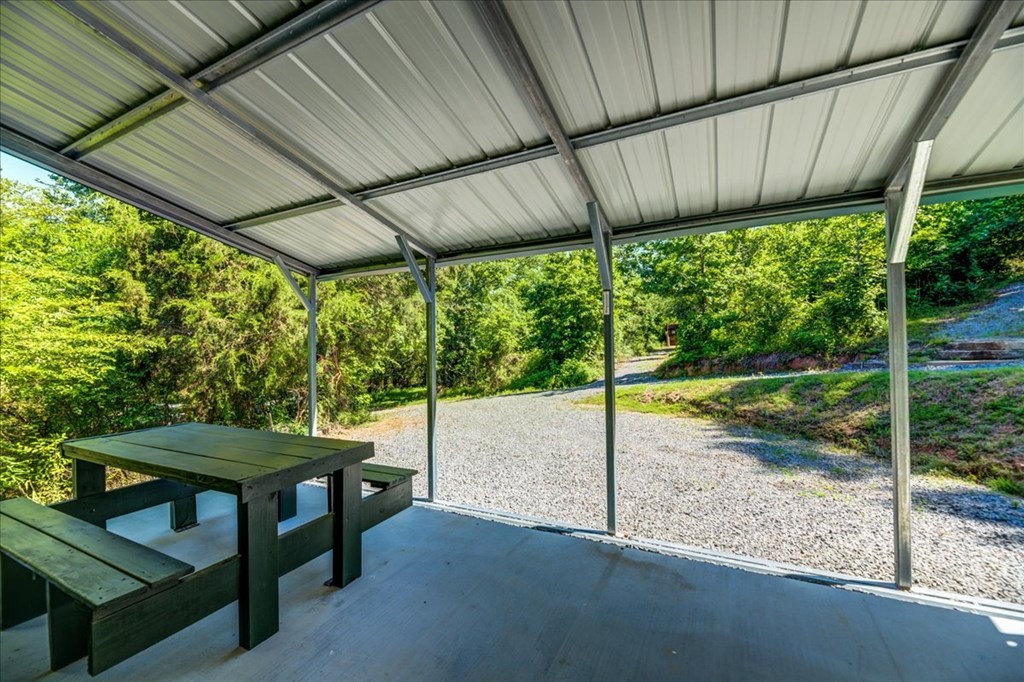 711 Redman Lane Decatur, TN 37322 - Photo 4 of 33 a view of a porch with furniture and yard