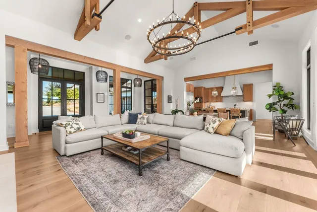 a living room with furniture ceiling fan and a rug
