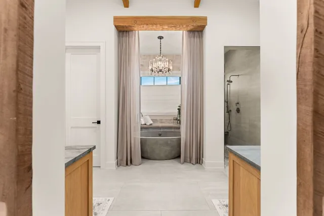 a bathroom with a glass shower door