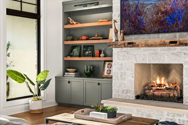 a living room with furniture and a fireplace