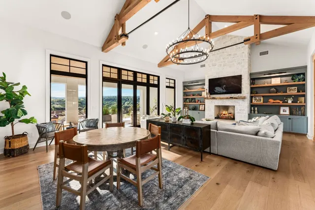 a living room with fireplace furniture and a flat screen tv