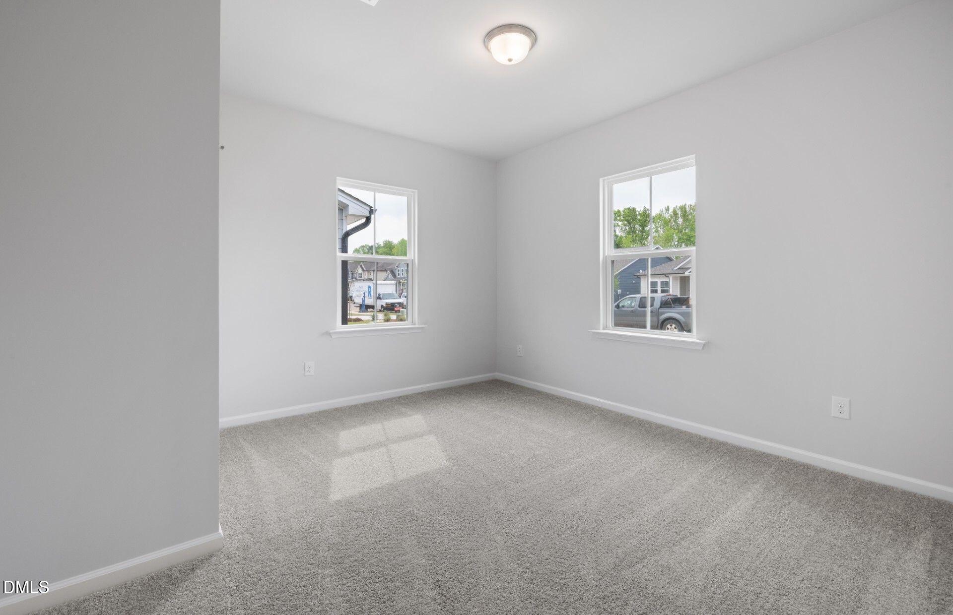 316 Broomside Avenue Raleigh, NC 27603 - Photo 18 of 31 an empty room with windows and closet