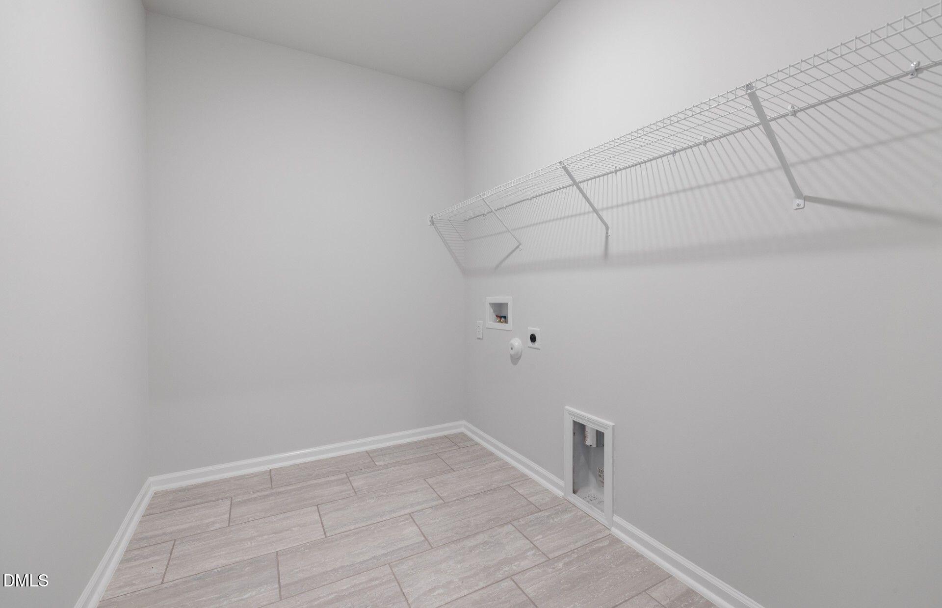 316 Broomside Avenue Raleigh, NC 27603 - Photo 20 of 31 a view of a room with racks on the wall