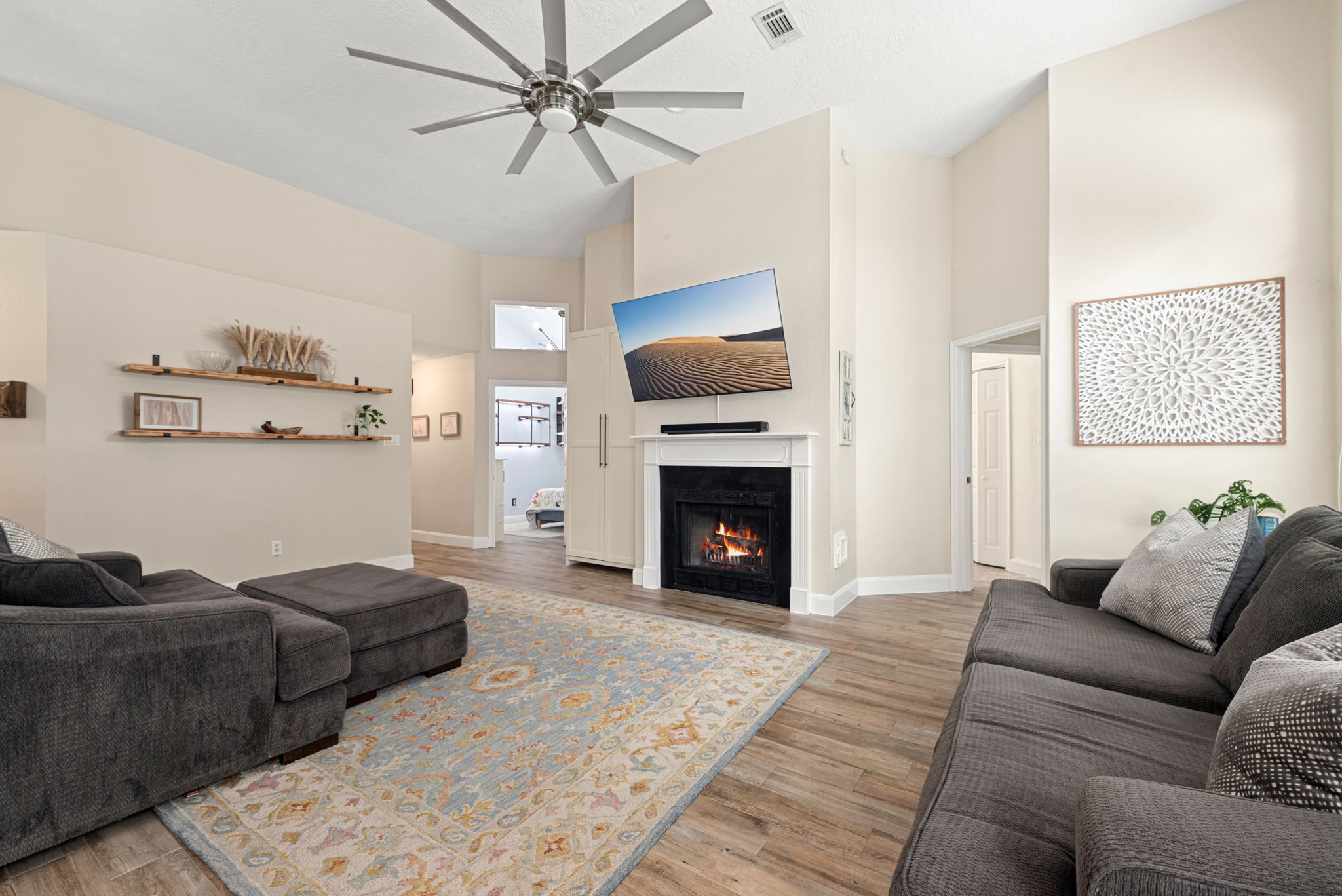 1915 Mercoal Drive Spring, TX 77386 - Photo 10 of 50 Inviting living area highlighted by a cozy fireplace and abundant natural light.