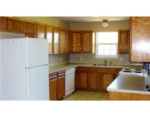 4202 Easy Street, Unit B Corpus Christi, TX 78418 - Photo 4 of 10 a kitchen with stainless steel appliances granite countertop a refrigerator a sink and a stove
