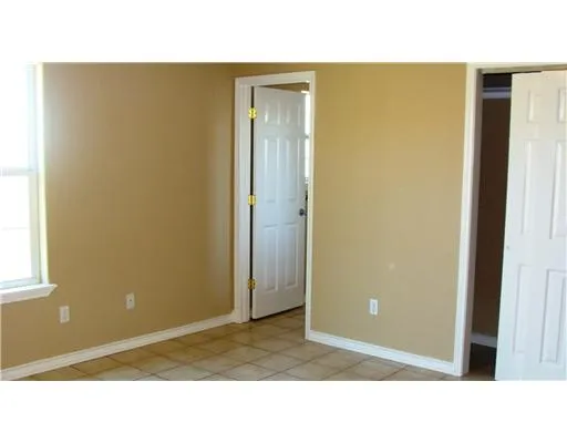 a bathroom with a toilet and shower