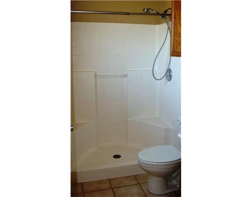 4202 Easy Street, Unit B Corpus Christi, TX 78418 - Photo 7 of 10 a bathroom with a toilet and shower