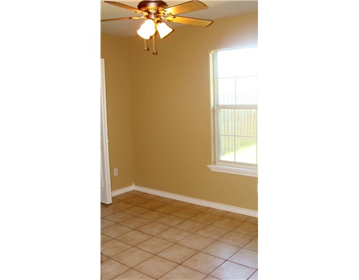 4202 Easy Street, Unit B Corpus Christi, TX 78418 - Photo 8 of 10 a view of an empty room with a window