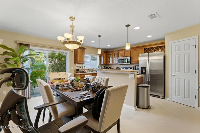 a view of a dining room with furniture window and outside view