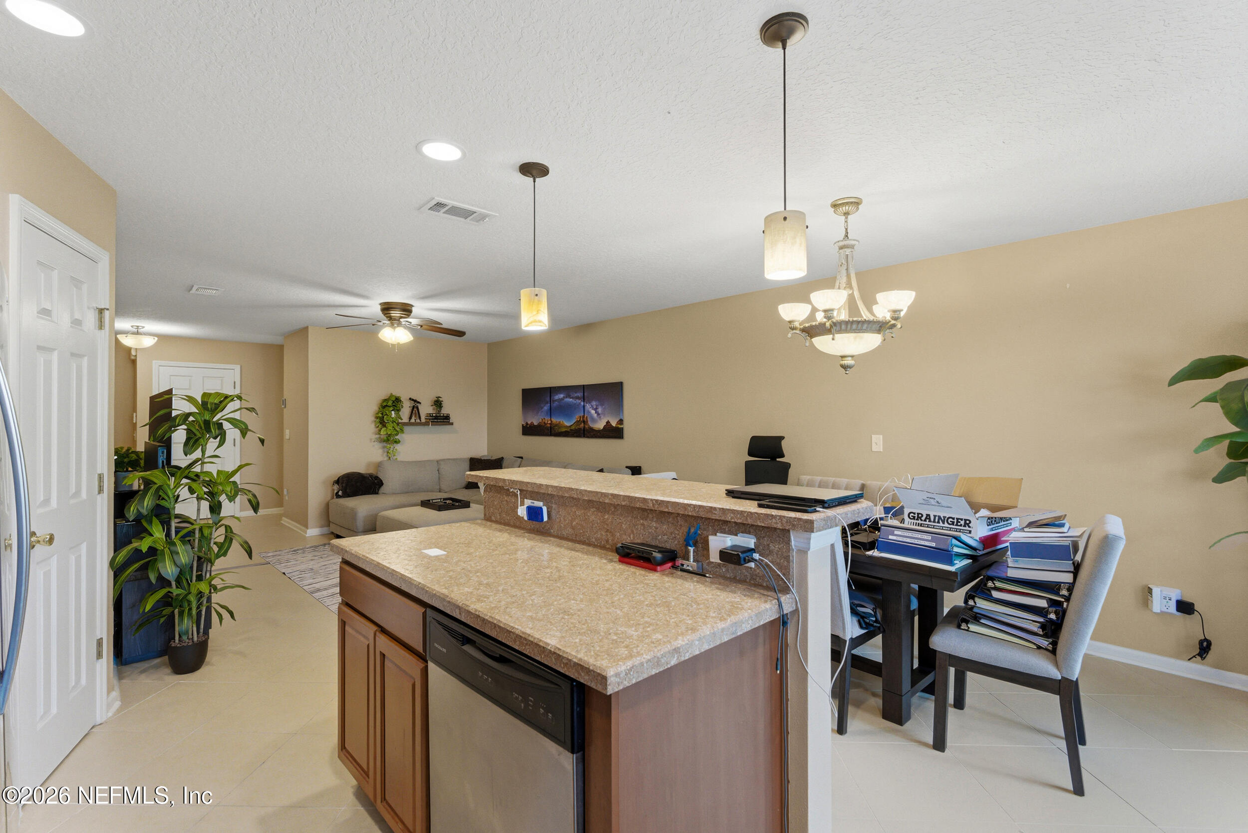 127 Crete Court St. Augustine, FL 32084 - Photo 15 of 33 a open kitchen with a table and chairs in it