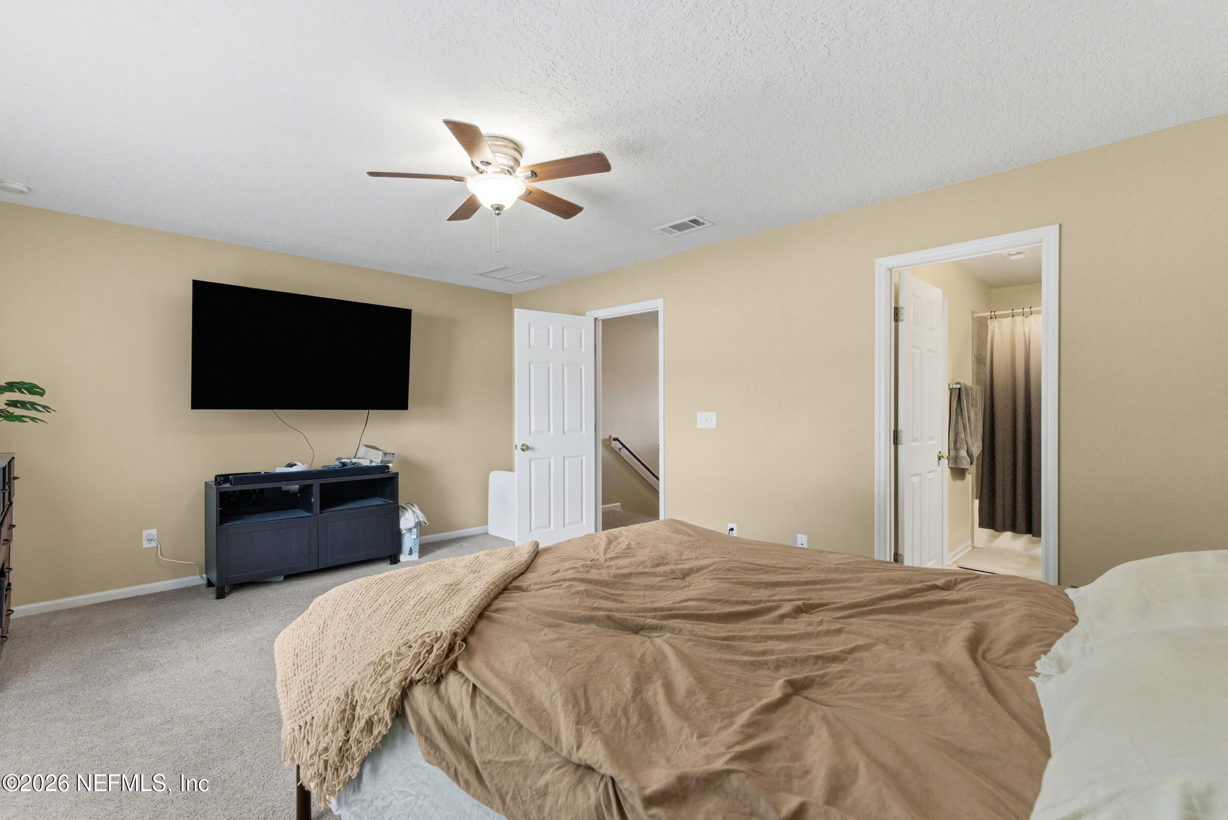 127 Crete Court St. Augustine, FL 32084 - Photo 18 of 33 a bedroom with a bed and a flat screen tv