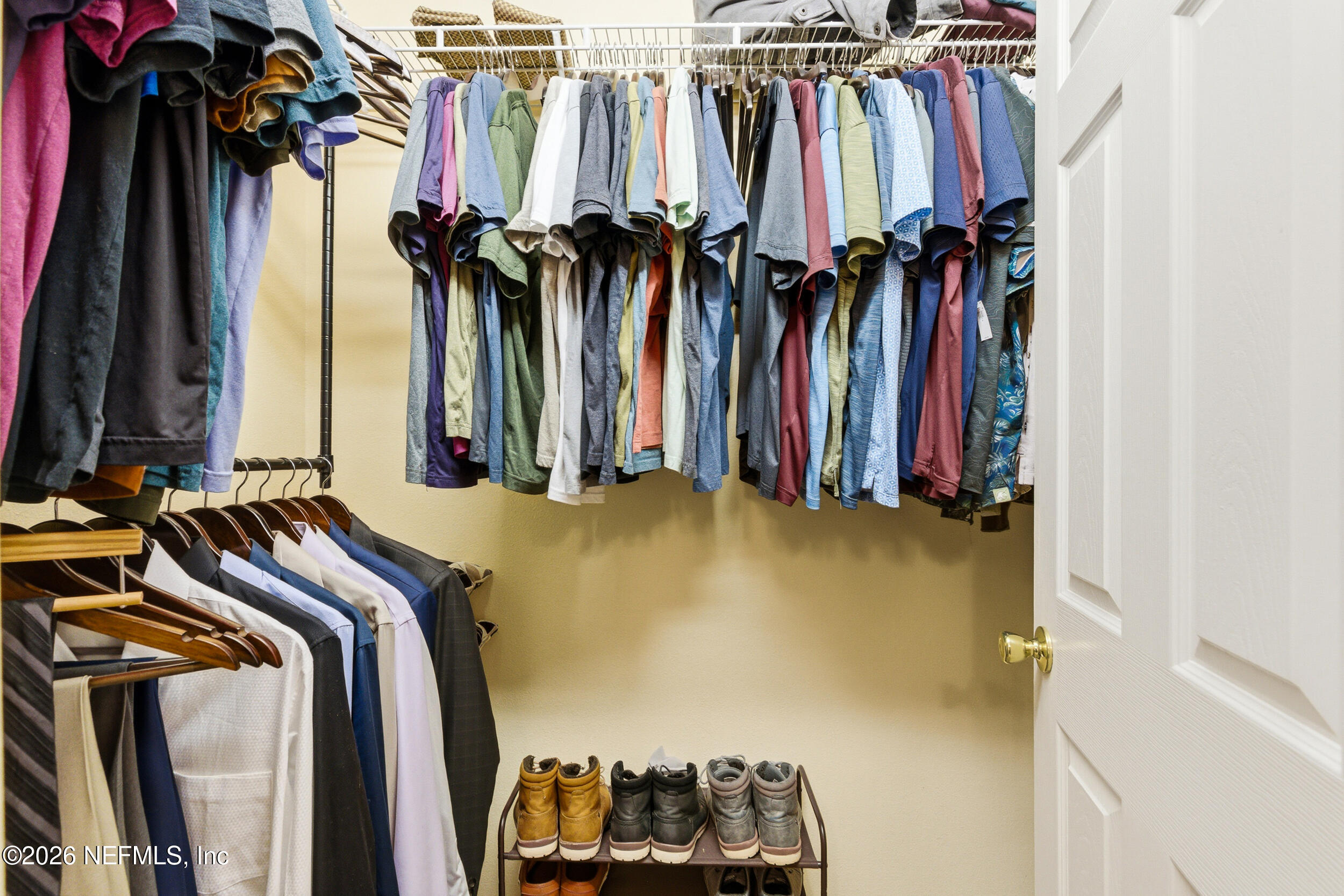 127 Crete Court St. Augustine, FL 32084 - Photo 20 of 33 a view of walk in closet with clothes