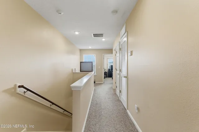 a view of hallway with stairs