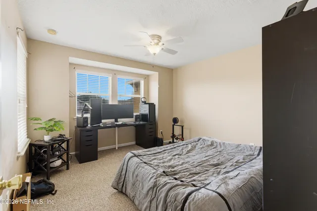 a bedroom with a bed and furniture