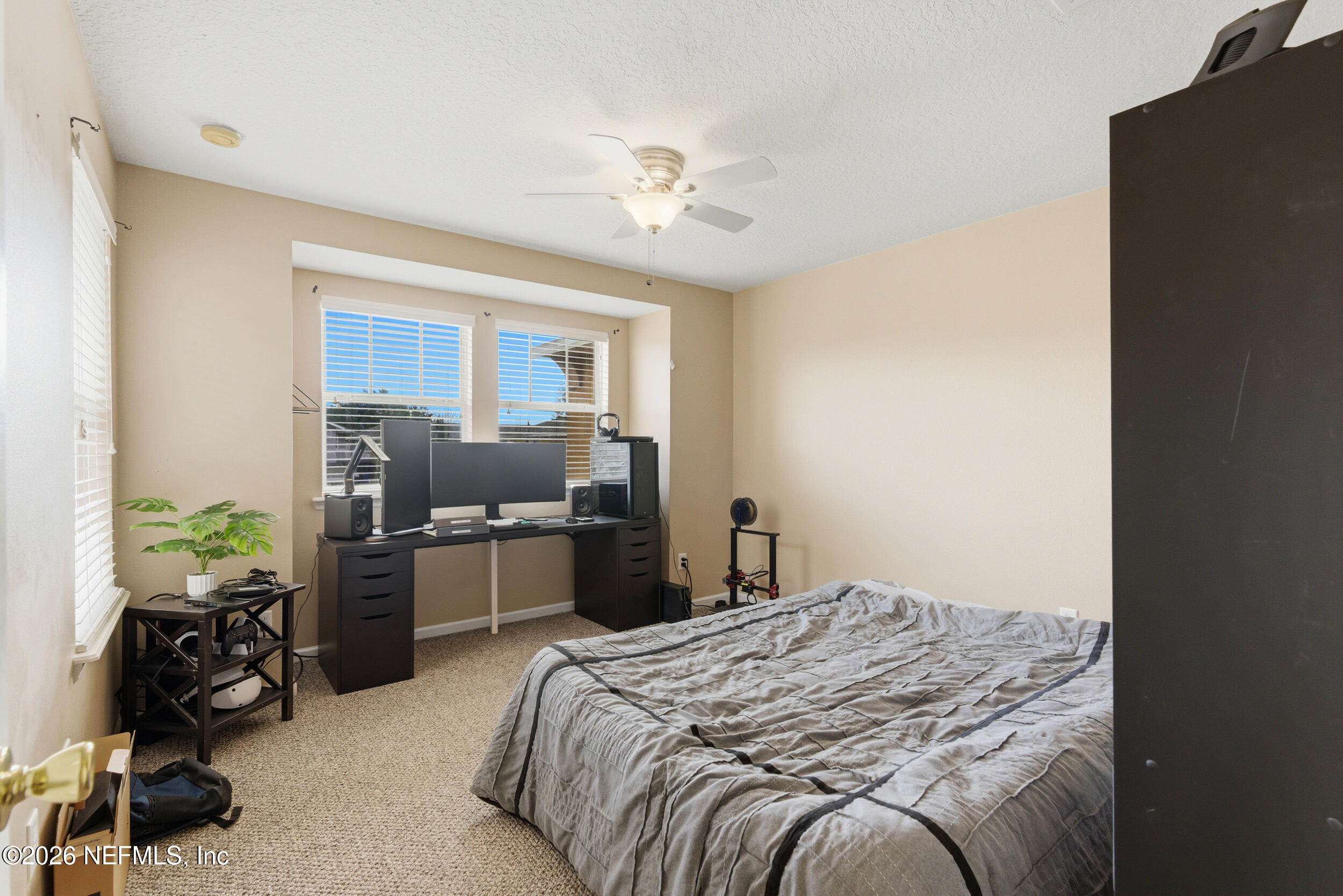 127 Crete Court St. Augustine, FL 32084 - Photo 24 of 33 a bedroom with a bed and furniture