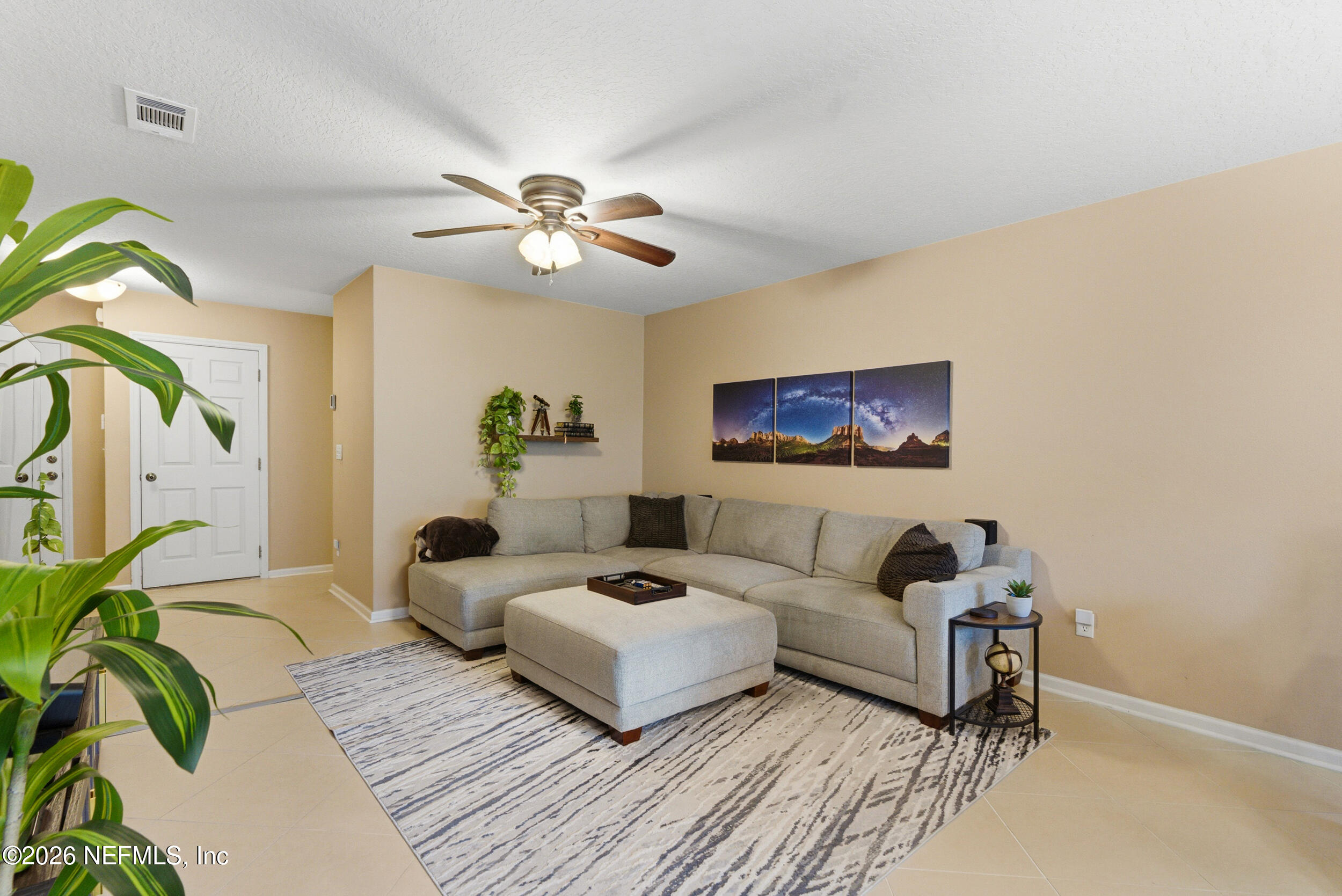 127 Crete Court St. Augustine, FL 32084 - Photo 9 of 33 a living room with furniture a chandelier and a rug