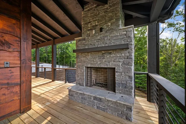 a kitchen with kitchen island granite countertop stainless steel appliances and a refrigerator