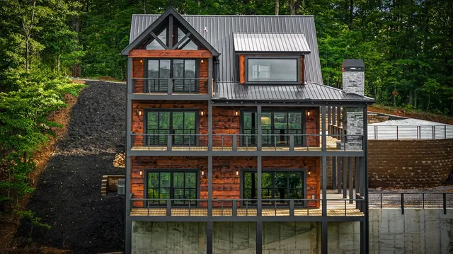 a backyard of a house with a yard and lake view