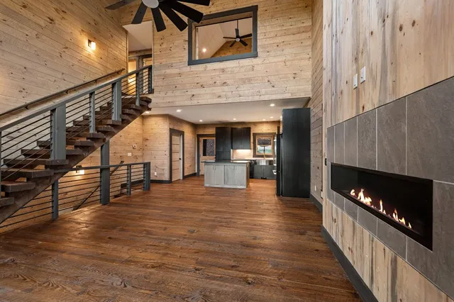 a kitchen with stainless steel appliances granite countertop a refrigerator a sink and a stove