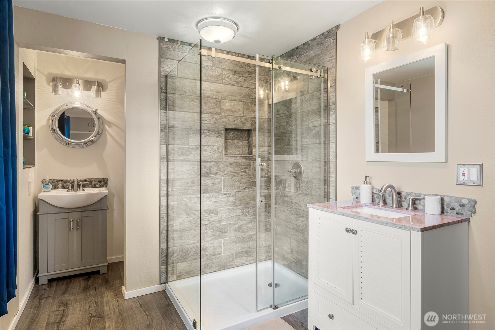 9537 South 213th Street Kent, WA 98031 - Photo 16 of 31 a bathroom with a shower a mirror and a sink