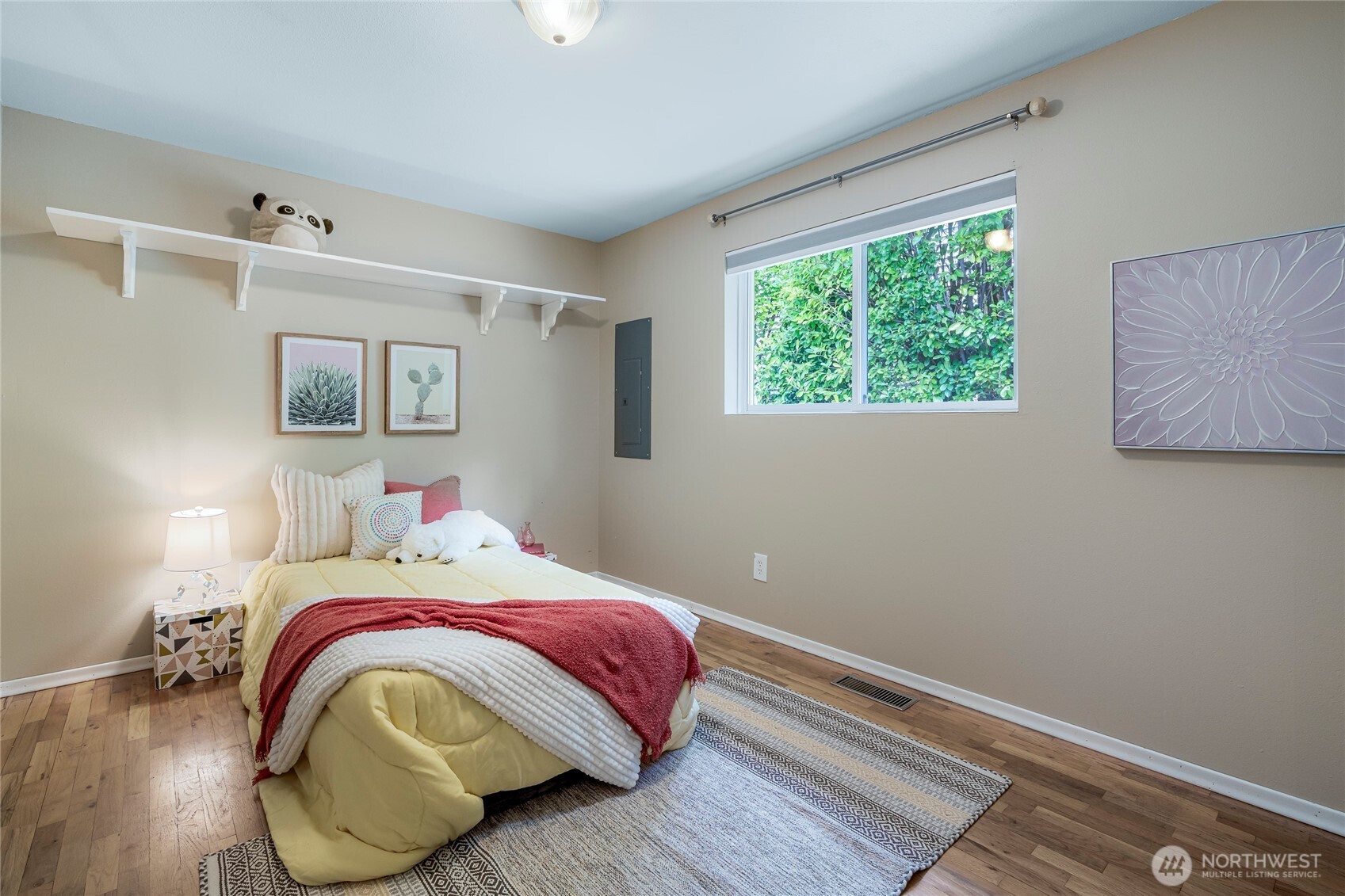 9537 South 213th Street Kent, WA 98031 - Photo 18 of 31 a bedroom with a bed and wooden floor