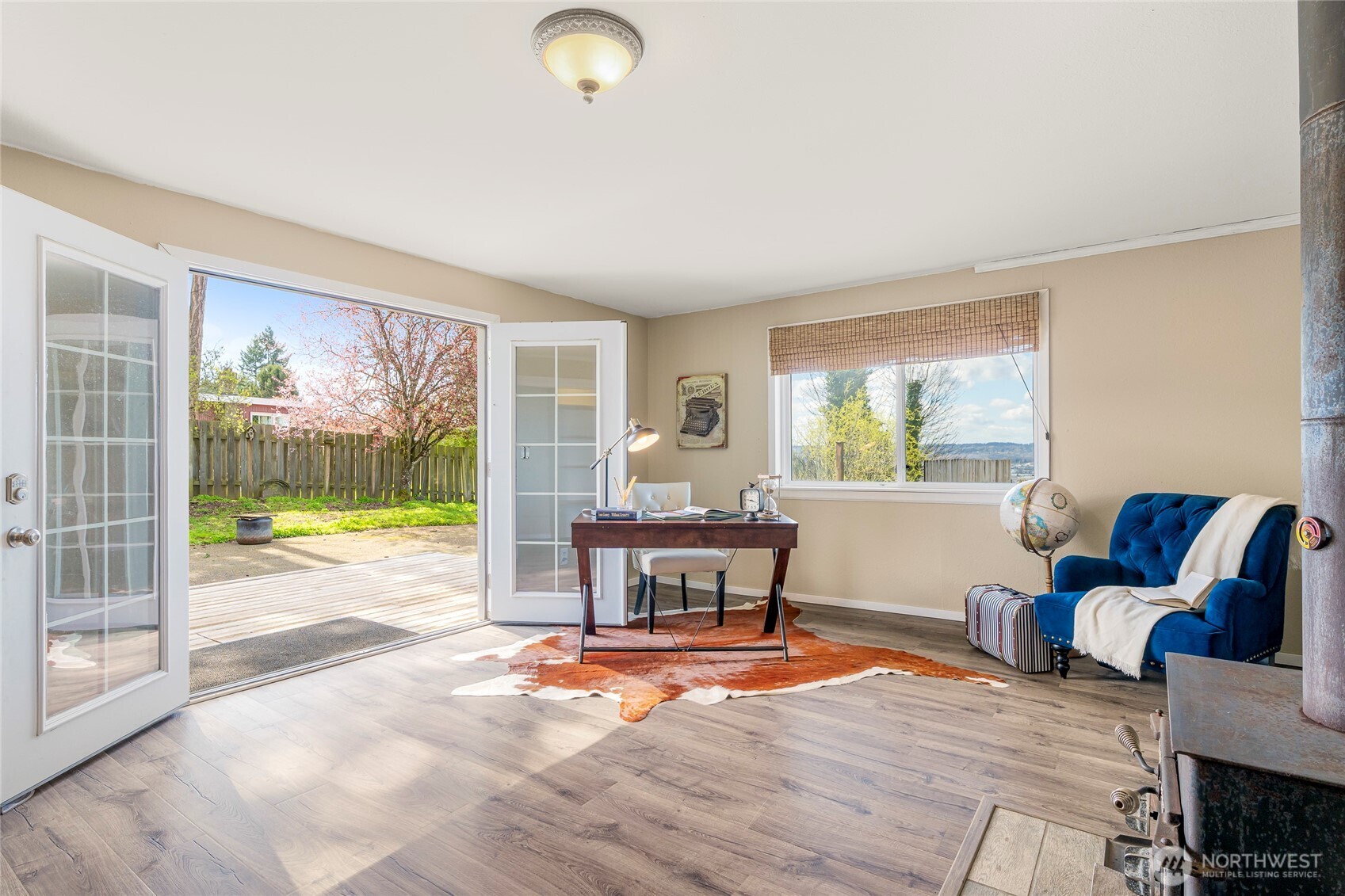 9537 South 213th Street Kent, WA 98031 - Photo 19 of 31 a living room with furniture and a floor to ceiling window